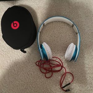 Blue BEATS headphones over the head. Not Bluetooth. Perfect for young kids